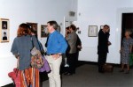 Photograph of people at exhibition opening at Huddersfield Art Gallery.